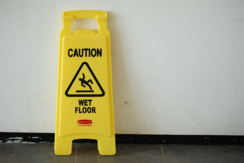 Caution sign that says Wet Floor for slip and fall warning